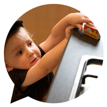 A picture of a child with matches.